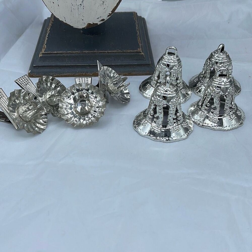 2 sets of 4 vintage silver bells and four clamp on candle holders
